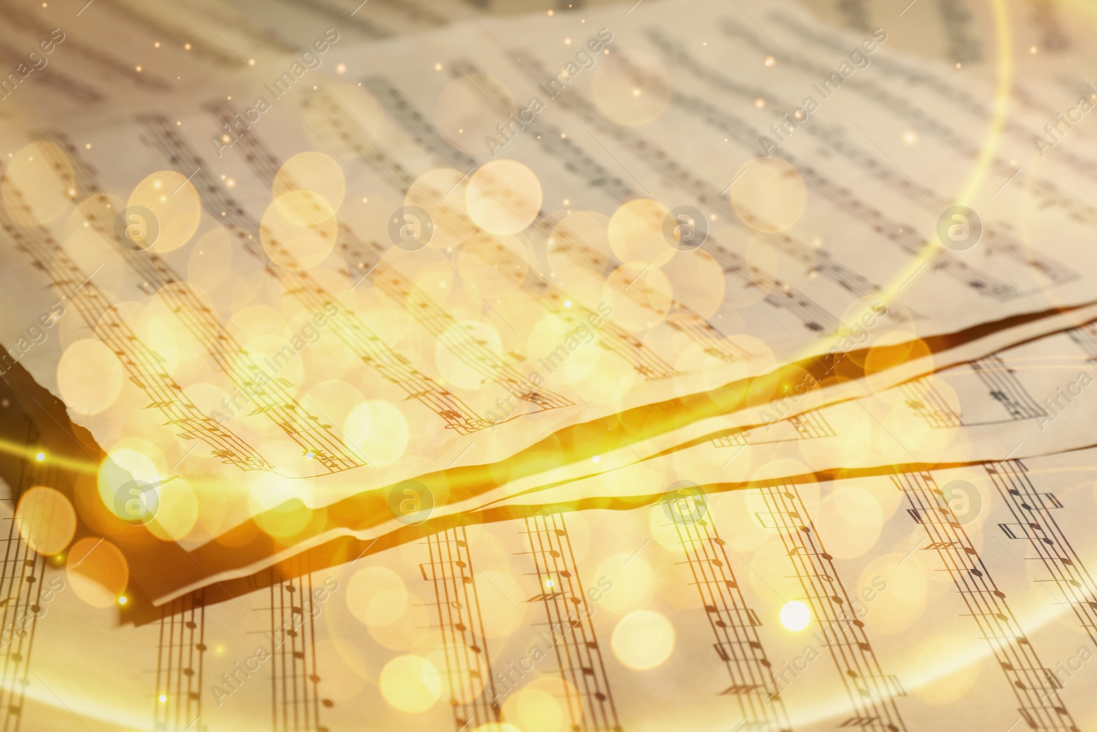 Image of Christmas and New Year music. Music sheets, bokeh effect
