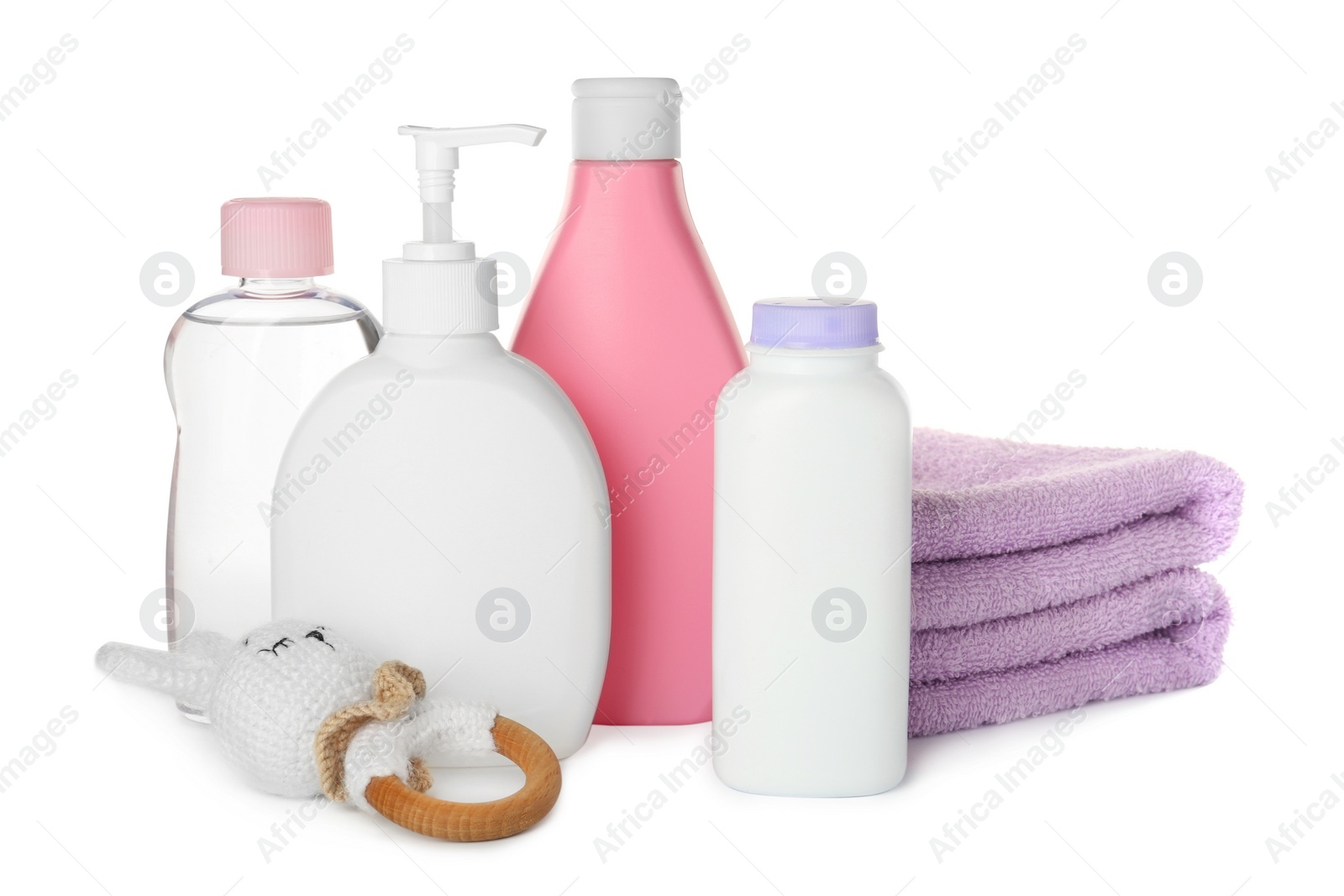 Photo of Set of baby cosmetic products, towels and toy on white background