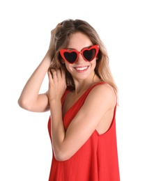 Young beautiful woman wearing heart shaped glasses on white background