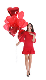 Photo of Beautiful girl with heart shaped balloons isolated on white. Valentine's day celebration