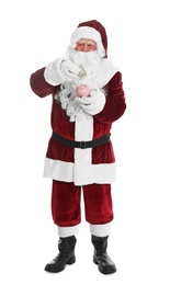 Photo of Santa Claus putting dollar banknote into piggy bank on white background