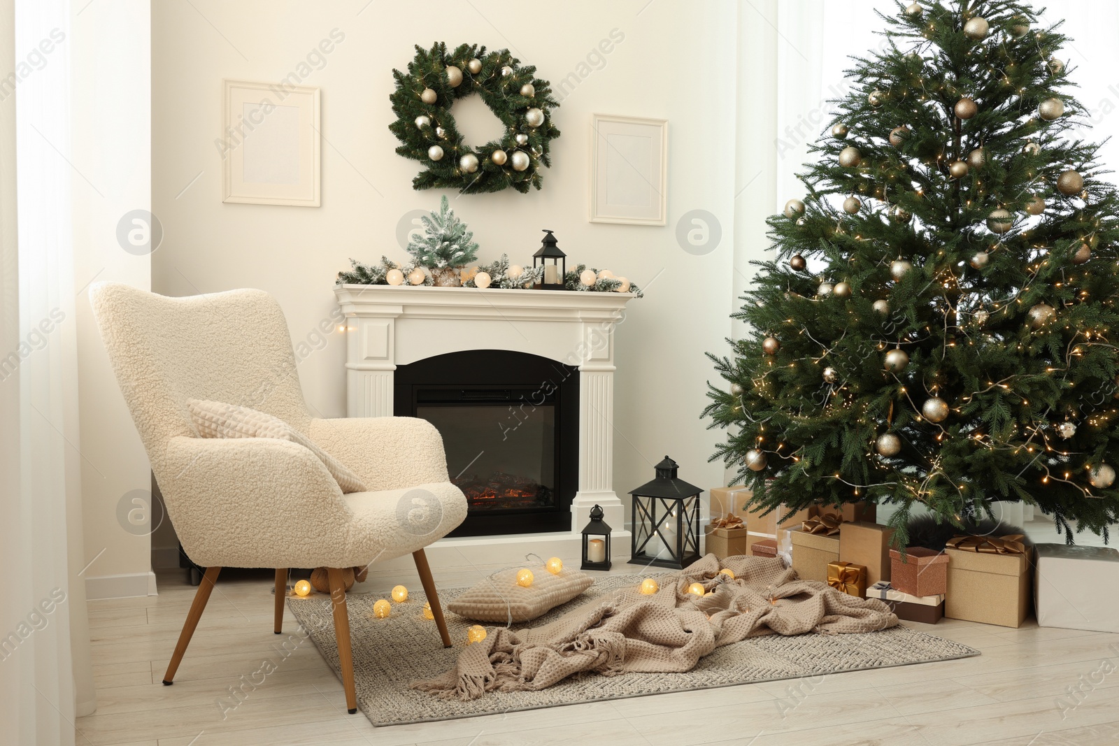 Photo of Cosy room with fireplace decorated for Christmas