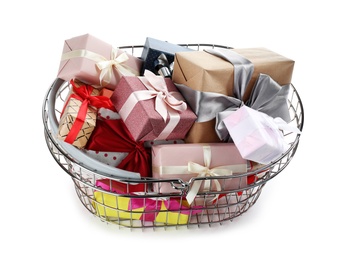 Photo of Shopping basket full of gift boxes on white background