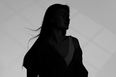 Image of Silhouette of one woman on grey background