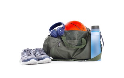 Photo of Gym bag with sports equipment on white background