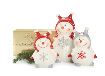 Photo of Christmas composition with decorative snowmen and gift box on white background