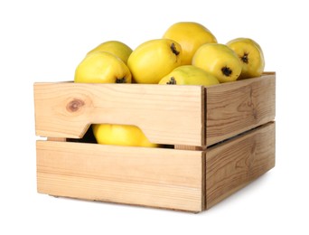 Photo of Wooden crate with delicious fresh ripe quinces isolated on white