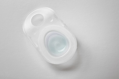 Photo of Package with contact lens on white background