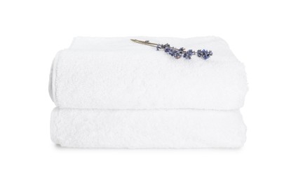 Photo of Terry towels and lavender flowers isolated on white