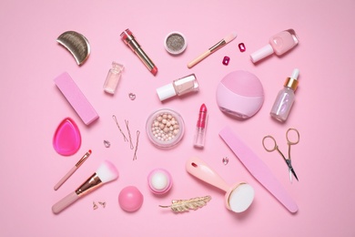 Photo of Flat lay composition with personal care products on pink background