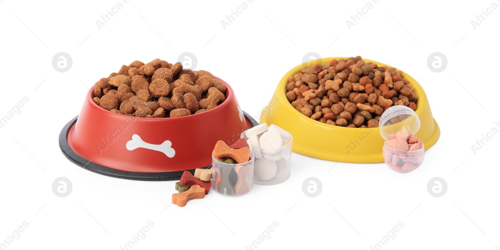 Photo of Dry pet food and vitamins isolated on white