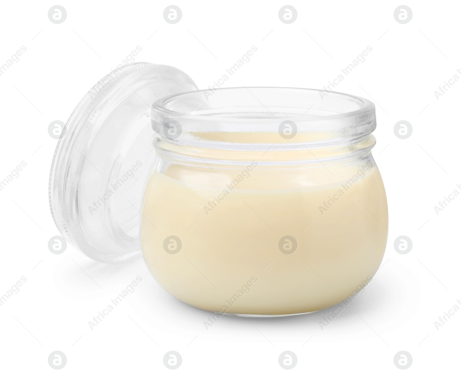 Photo of Open jar with condensed milk isolated on white