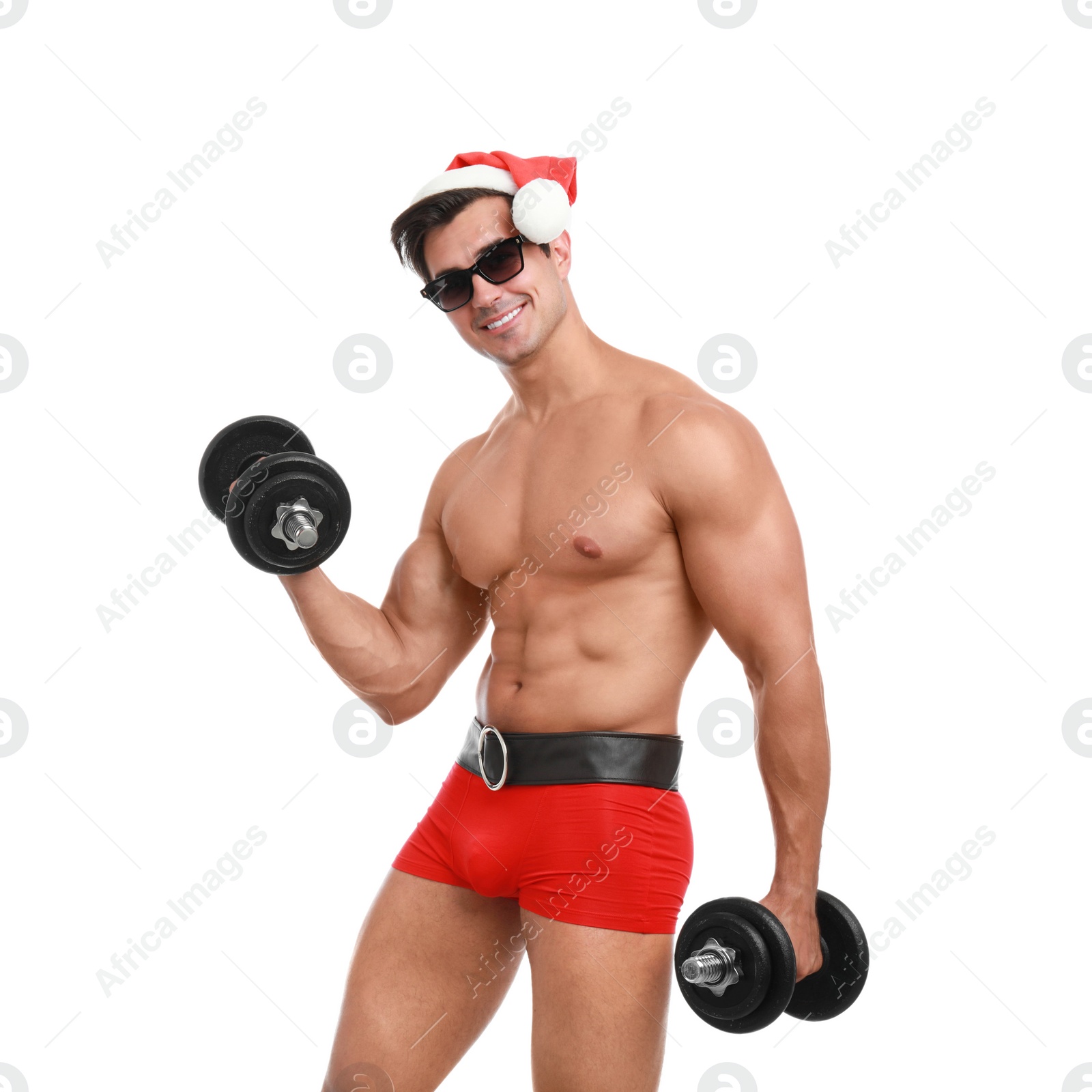 Photo of Sexy shirtless Santa Claus with dumbbells on white background