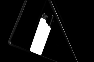 Photo of Stylish presentation of small pocket lighter on black background