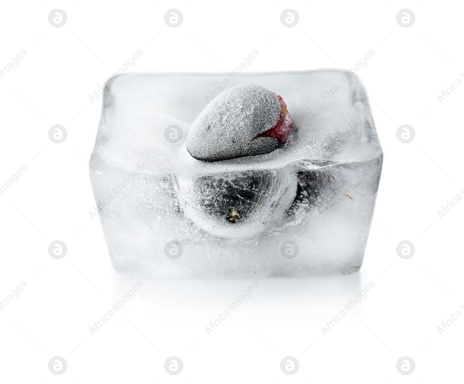 Photo of Fresh berry frozen in ice cube on white background