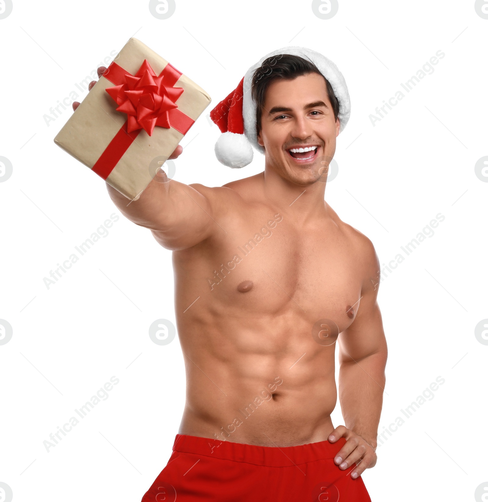 Photo of Sexy shirtless Santa Claus with gift on white background