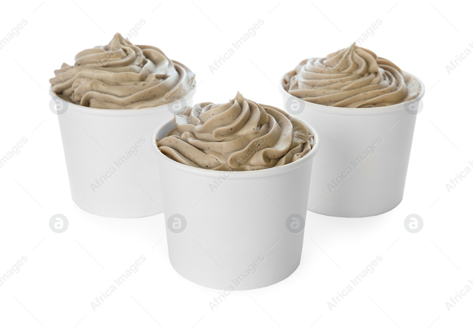 Photo of Cups with tasty frozen yogurt on white background