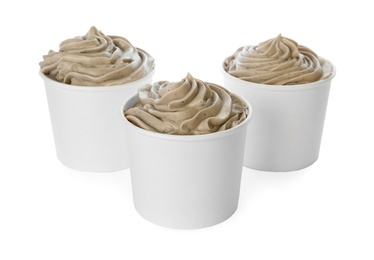 Photo of Cups with tasty frozen yogurt on white background