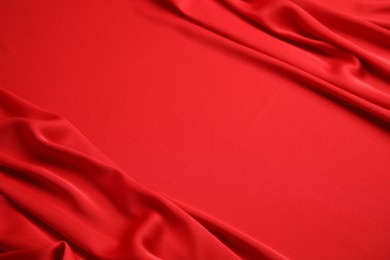 Texture of delicate red silk as background, closeup