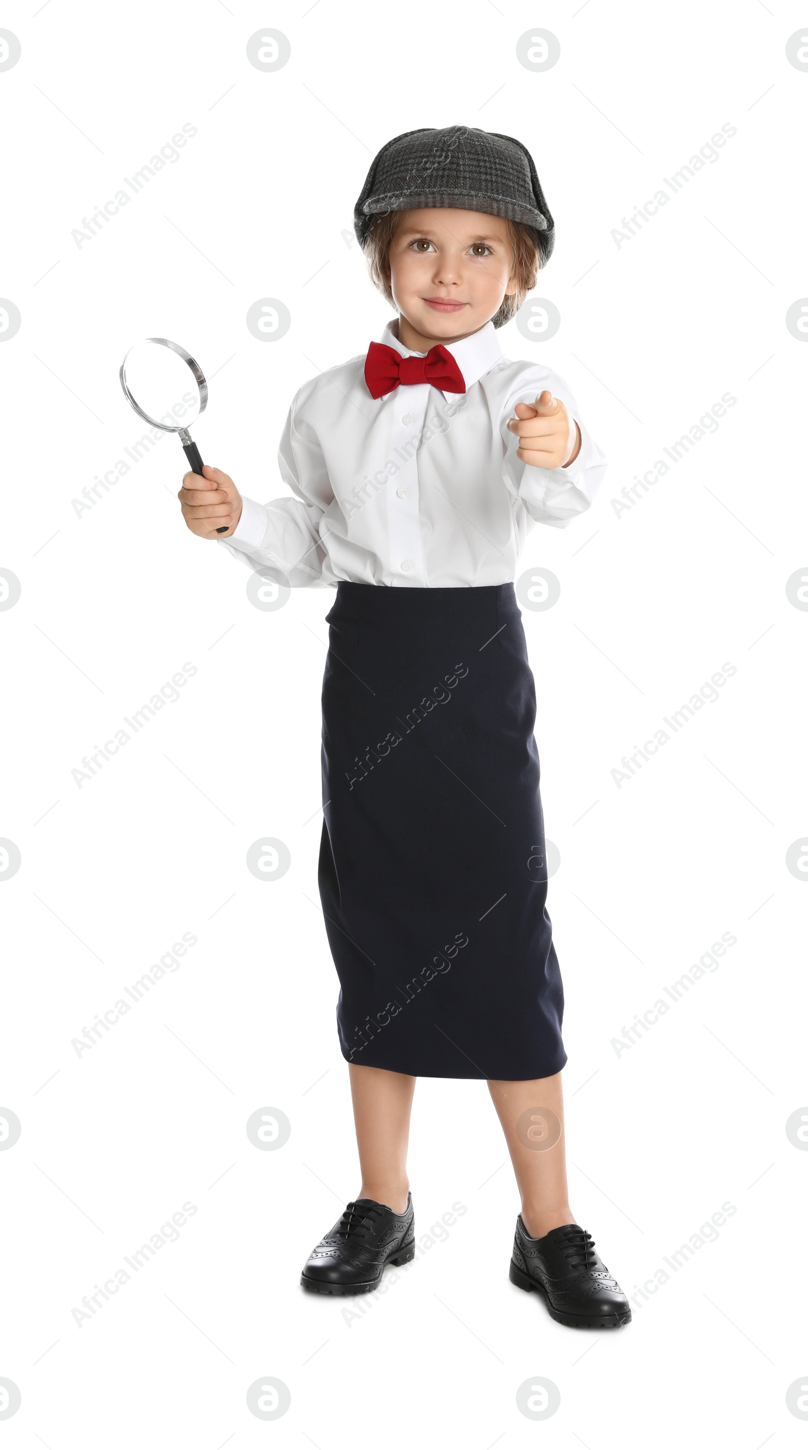 Photo of Cute little child in hat with magnifying glass playing detective on white background