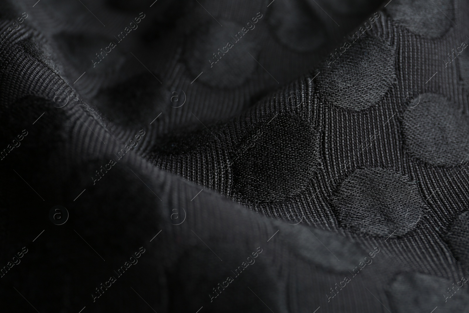 Photo of Textured black fabric as background, closeup view