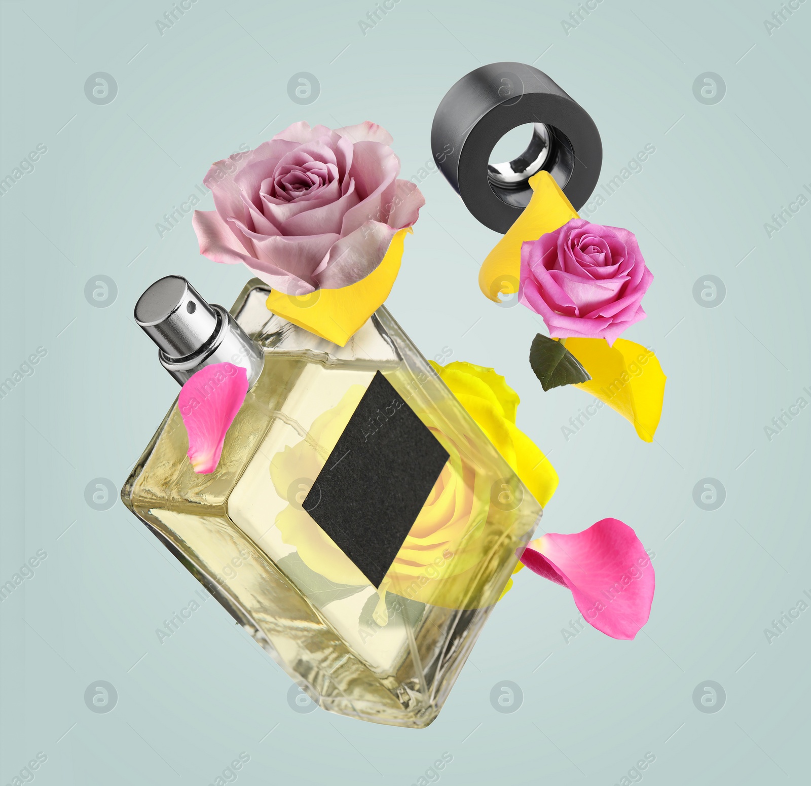 Image of Bottle of perfume and roses in air on grey background. Flower fragrance