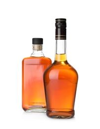 Photo of Bottles of scotch whiskey on white background