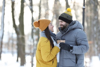 Beautiful young couple enjoying winter day outdoors