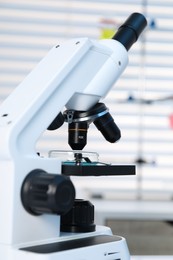 Photo of Laboratory analysis. Modern medical microscope indoors, closeup