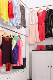 Photo of Modern dressing room with different stylish clothes and accessories