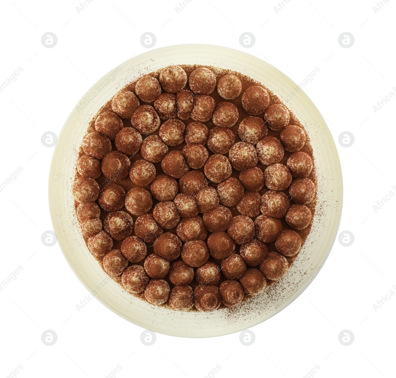 Photo of One delicious tiramisu cake with cocoa powder isolated on white, top view