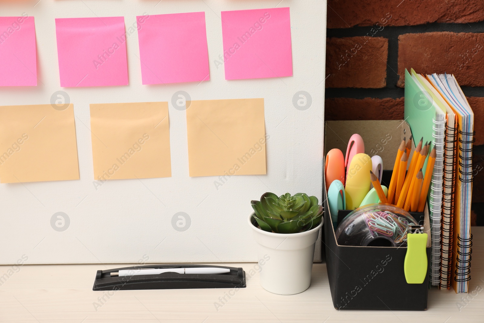 Photo of Business process planning and optimization. Workplace with colorful paper notes and other stationery on table