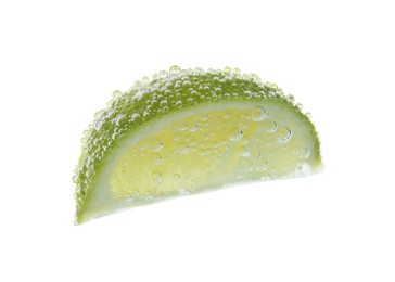 Photo of Fresh lime slice in sparkling water on white background