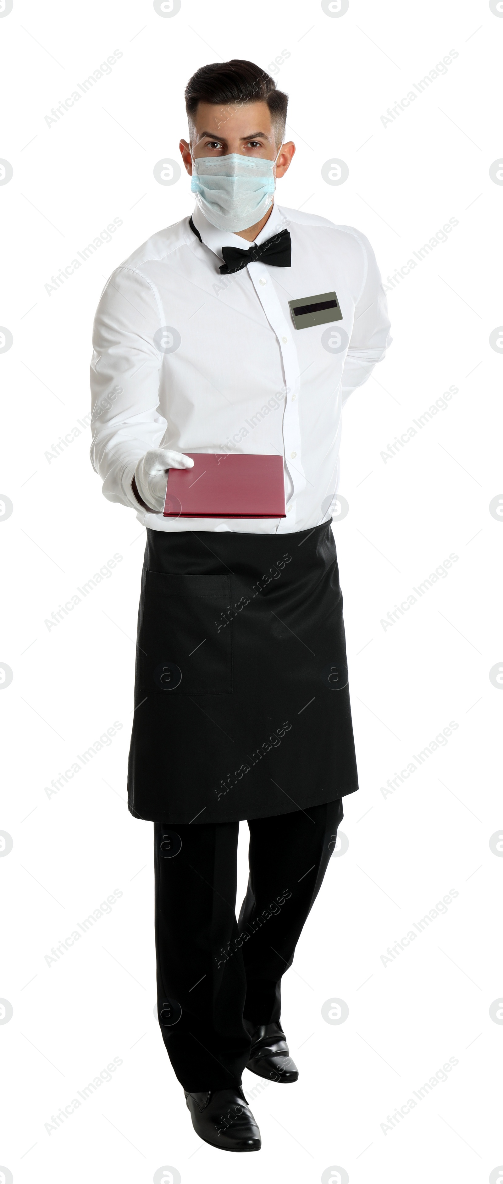 Photo of Waiter in medical face mask with menu on white background