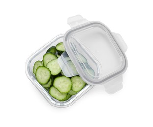 Photo of Glass container with fresh cut cucumbers and lid isolated on white, top view