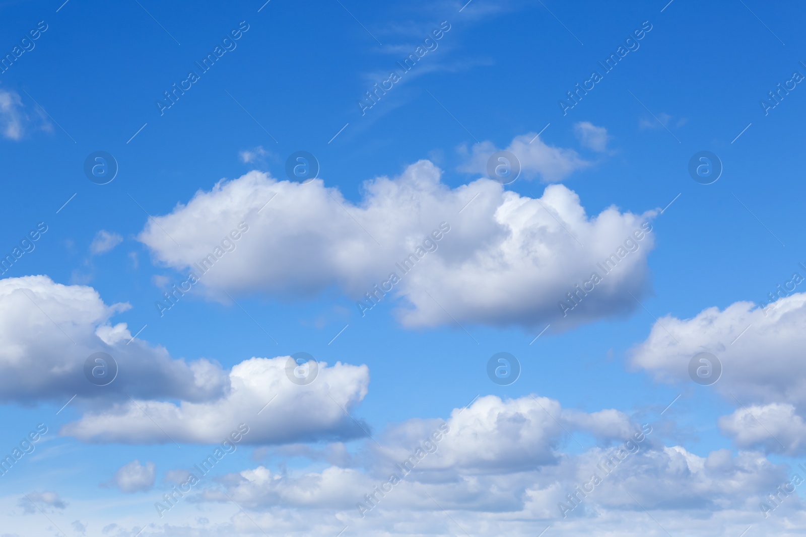 Photo of Picturesque blue sky with white clouds on sunny day