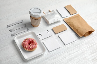 Photo of Composition with items for mock up design on wooden background. Food delivery service