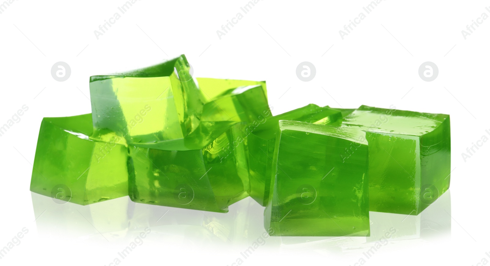 Photo of Heap of green jelly cubes on white background