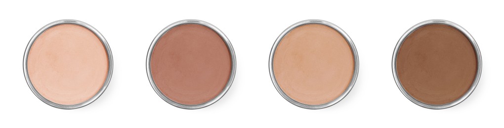Compact face powders of different shades isolated on white, collection. Top view