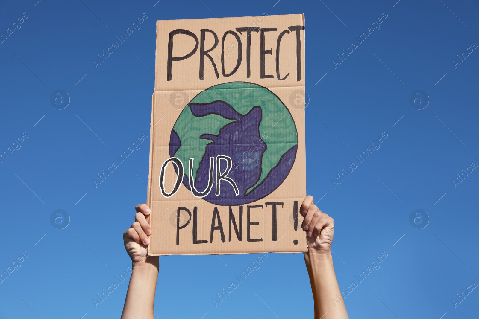 Photo of Man with poster protesting against climate change outdoors, closeup