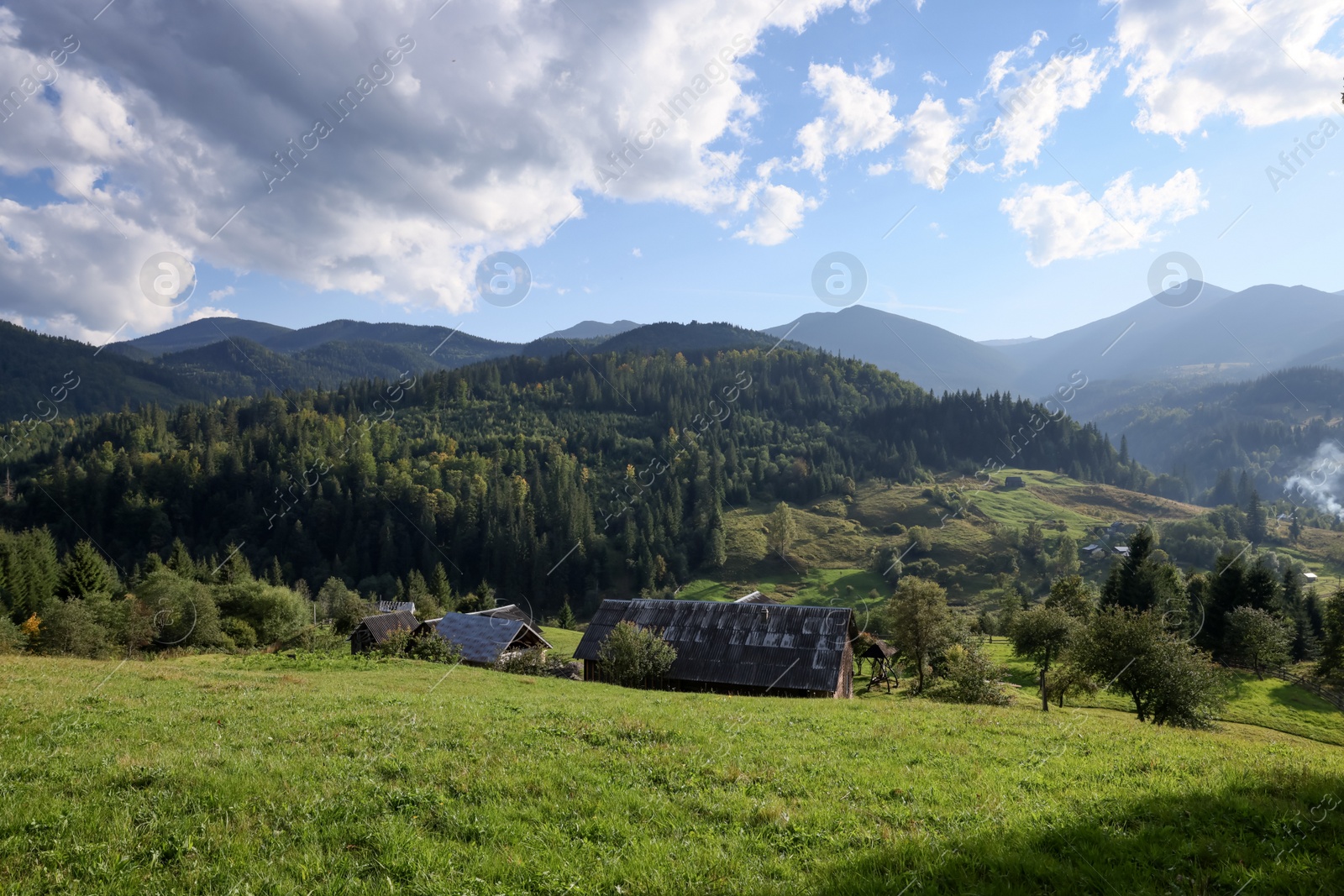 Photo of Beautiful view of village in mountains on sunny day