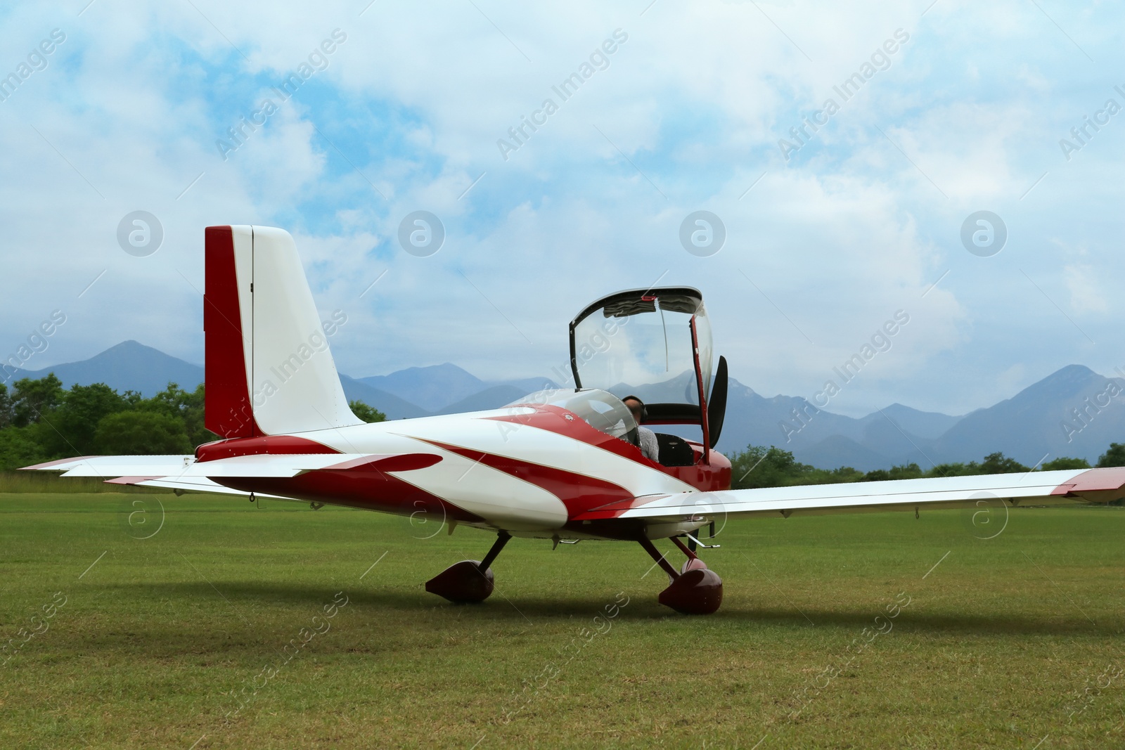 Photo of View of beautiful ultralight airplane in field on autumn day