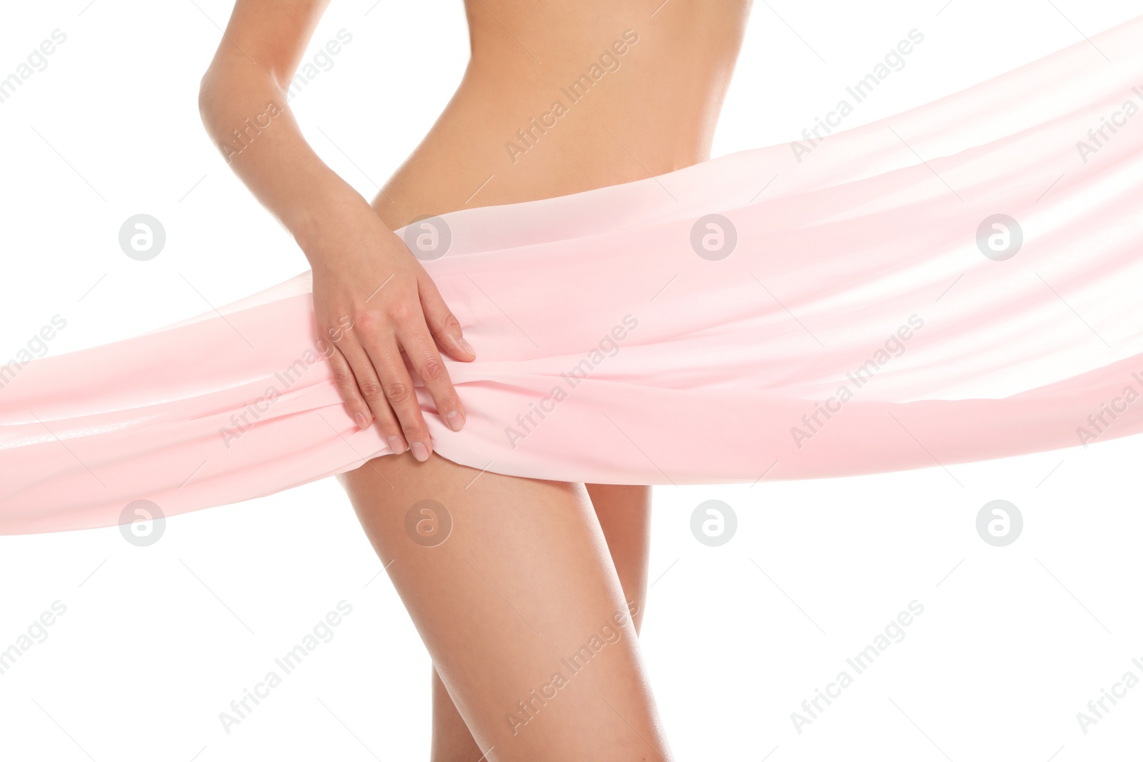 Photo of Slim young woman covered with silk fabric on white background, closeup. Fit body