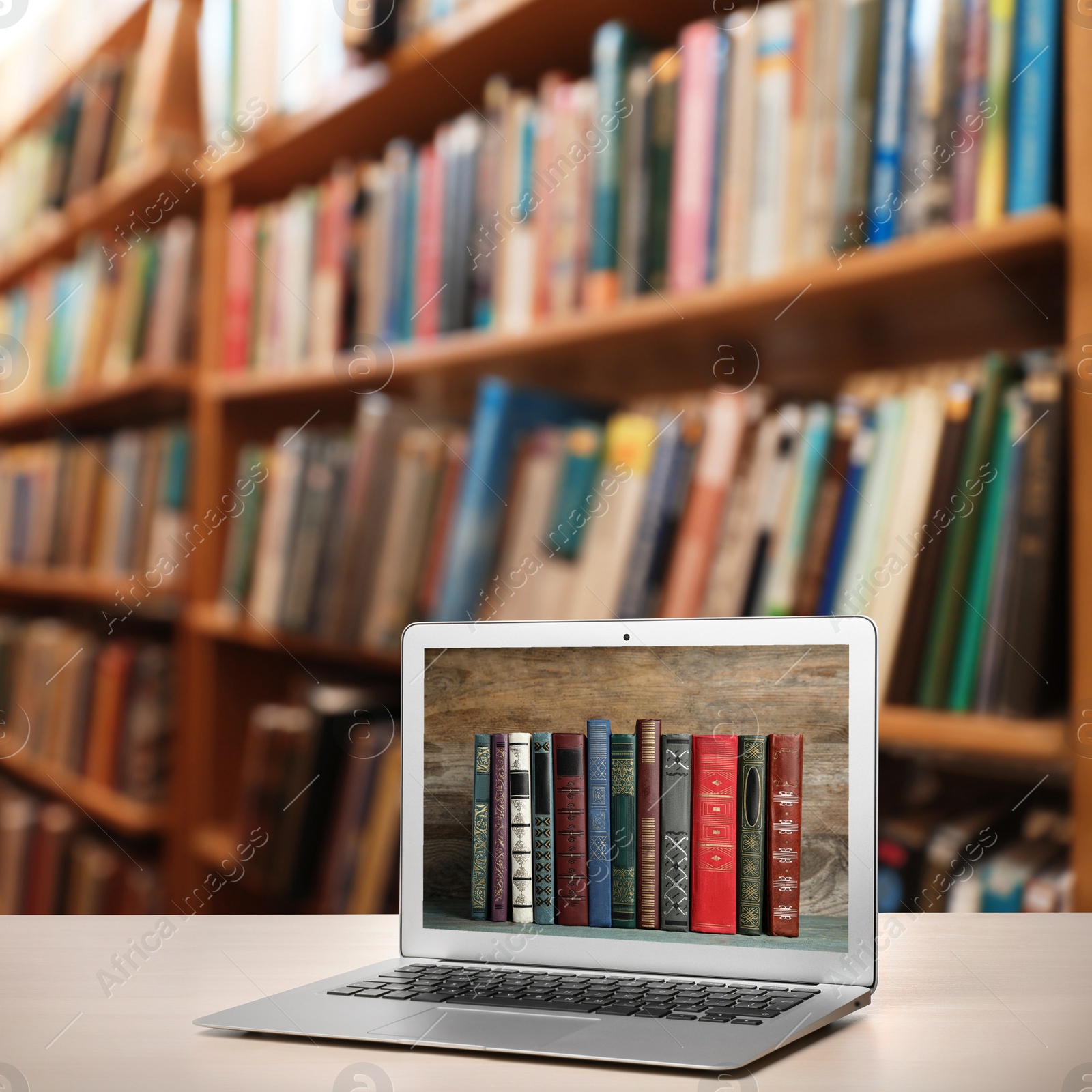 Image of Digital library concept. Modern laptop on table indoors