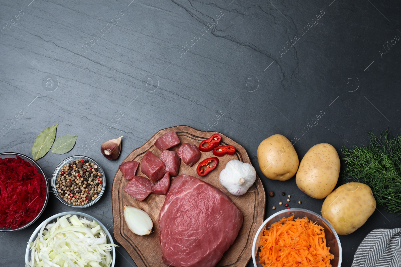 Photo of Fresh borscht ingredients on black table, flat lay. Space for text