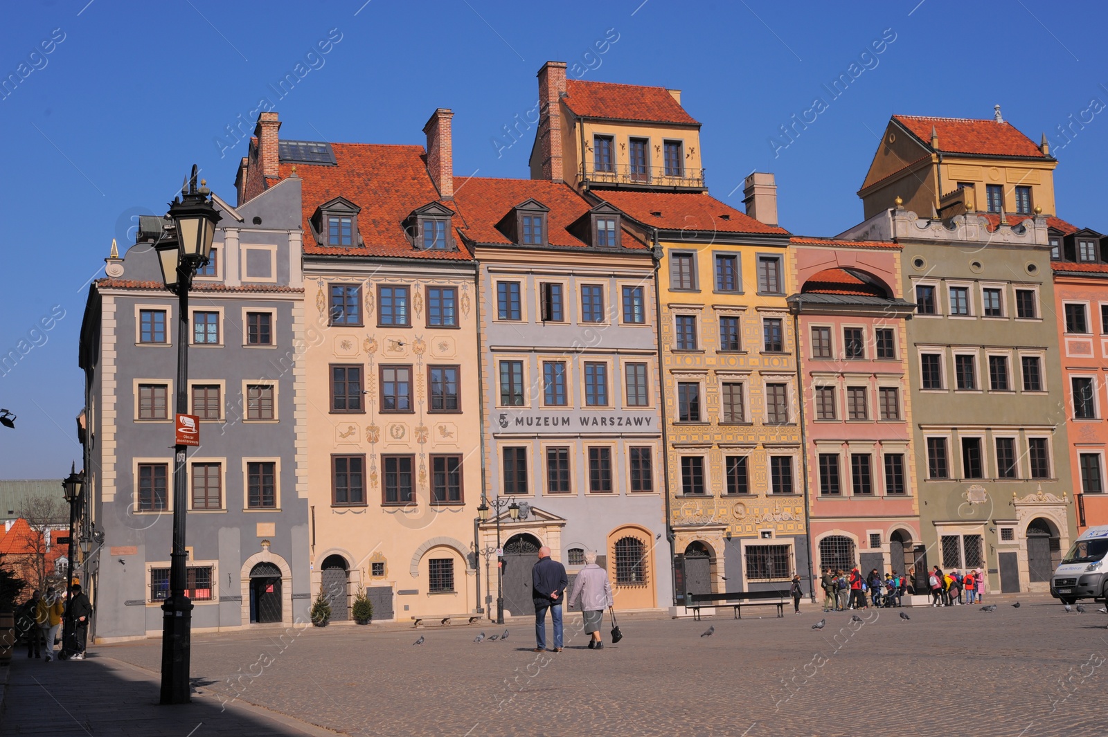 Photo of WARSAW, POLAND - MARCH 22, 2022: Beautiful view of Old Town city street on sunny day