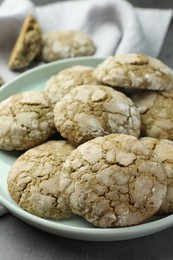 Plate with tasty matcha cookies on grey table, closeup