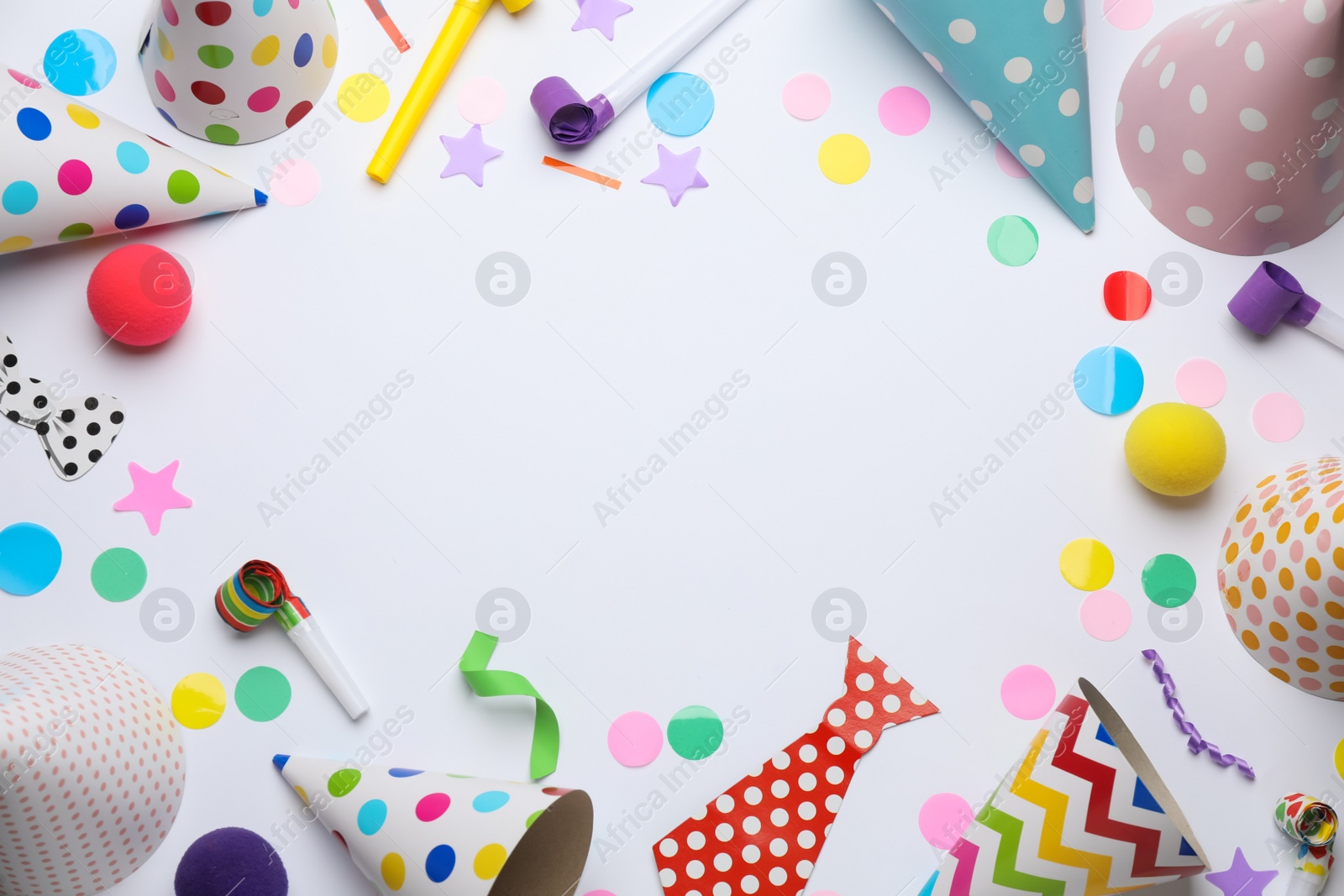Photo of Frame of party items on white background, flat lay. Space for text