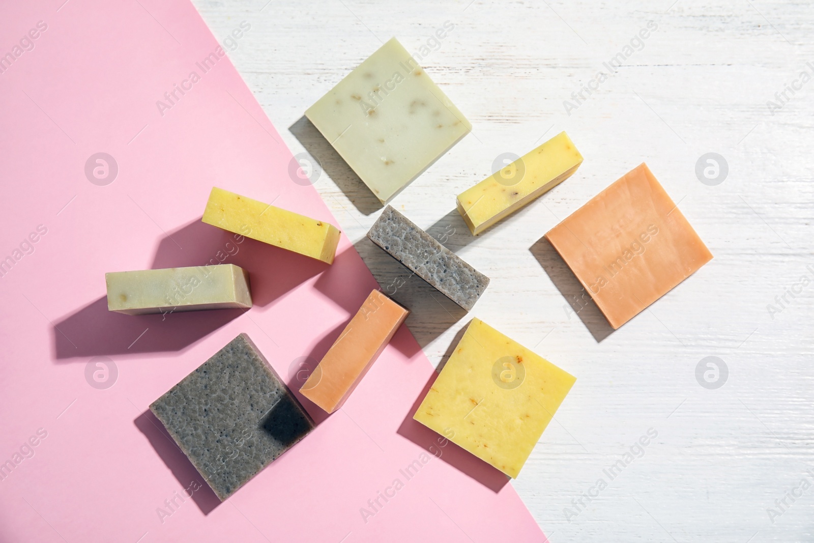 Photo of Hand made soap bars on color background, top view