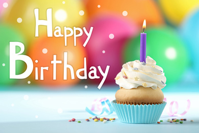 Text Happy Birthday and delicious cupcake with candle on blurred background